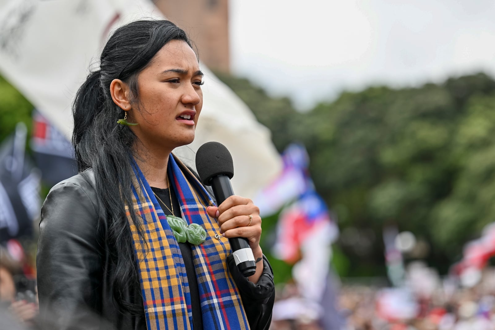 FILE -Hana-Rāwhiti Maipi-Clarke speaks to the thousands of people gathered outside New Zealand's parliament to protest a proposed law that would redefine the country's founding agreement between Indigenous Māori and the British Crown, in Wellington, Nov. 19, 2024. (AP Photo/Mark Tantrum, File)