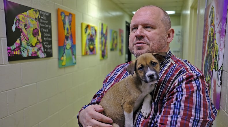 Roger Ganley, Clark County Humane Society director, holds a shephard mixed puppy that’s at the shelter. The Clark County Humane Society is in danger of closing. A fundraising campaign has been started to continue services. Bill Lackey/Staff