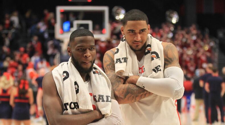 Dayton’s Jalen Crutcher and Obi Toppin pose for a photo after a victory against St. Bonaventure on Wednesday, Jan. 22, 2020, at UD Arena. David Jablonski/Staff
