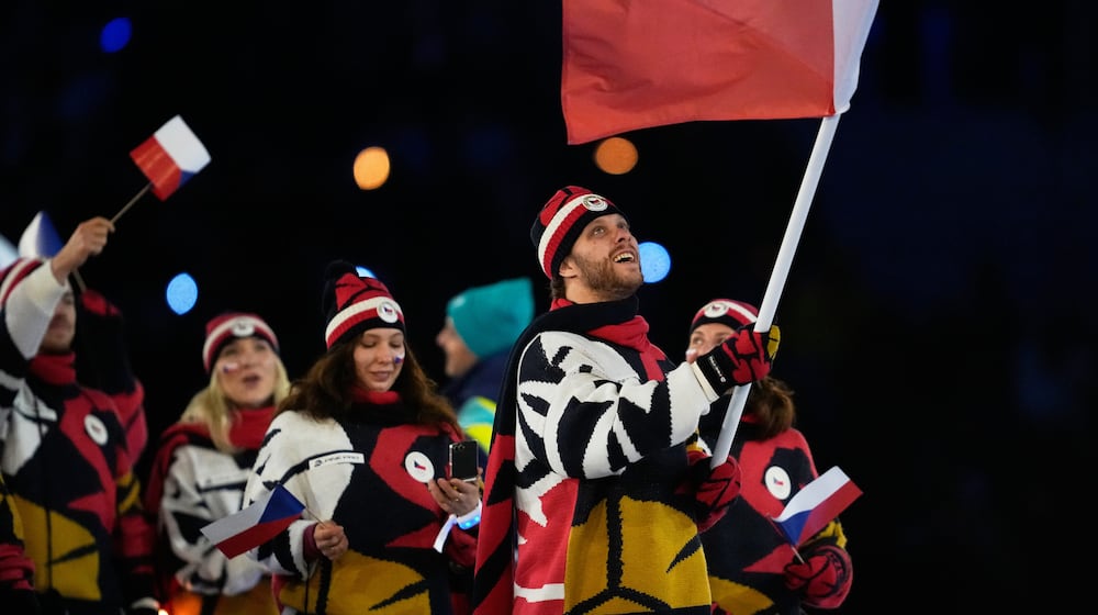 David Pastrnak, flag bearer of Czechia arrives during the Olympic opening ceremony at the 2026 Winter Olympics, in Milan, Italy, Friday, Feb. 6, 2026. (AP Photo/Ashley Landis)