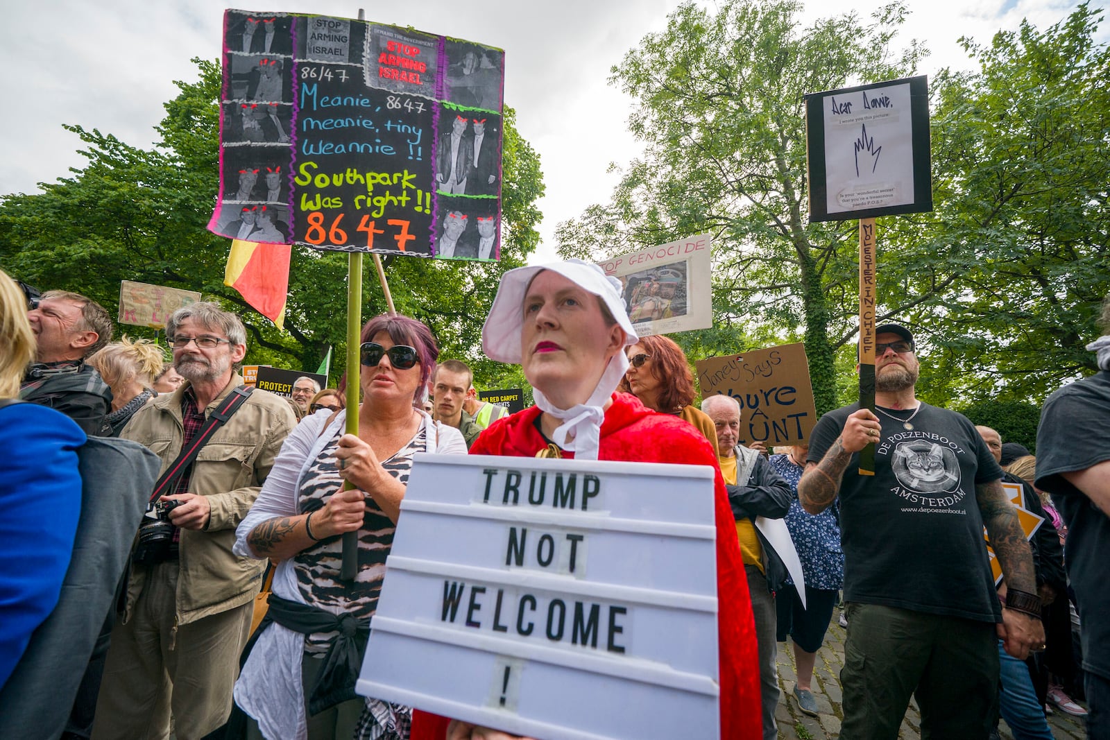 People take part in a Stop Trump Scotland protest outside the US Consulate in Edinburgh, as President Donald Trump begins his five-day private trip to the country at his Turnberry golf course in South Ayrshire on Saturday July 26, 2025. (Jane Barlow /PA via AP)