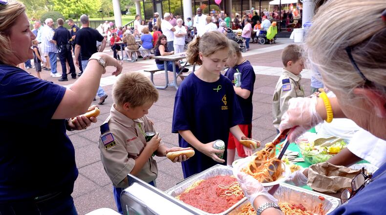 A free dinner is served at the National Night Out celebration on the City Hall Plaza during the 2015 event. It’s being moved to the playground area in Snyder Park this year. Bill Lackey/Staff