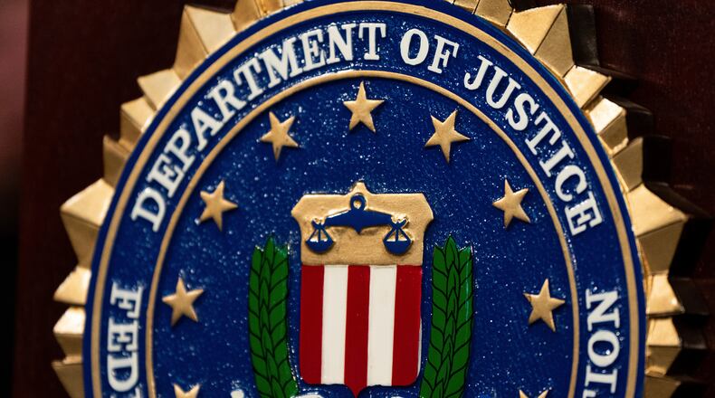 FILE - An FBI seal is displayed on a podium before a news conference at the field office in Portland, Ore., Thursday, Jan. 16, 2025. (AP Photo/Jenny Kane, File)