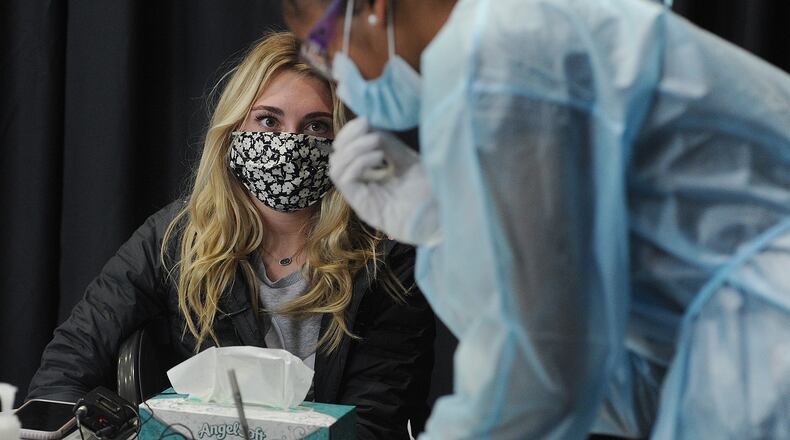 University of Dayton., junior, Cate Hawkins, waits for results of her COVID-19 test, Friday was the first day back for spring 2021 semester at the University of Dayton. MARSHALL GORBY\STAFF