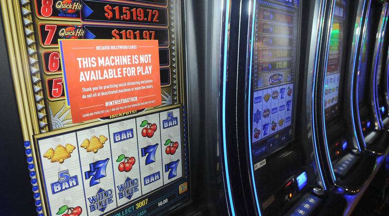 Ohio casinos and racinos are permitted to reopen at 6 am Friday, but at the Dayton Hollywood Racino the experience will be different. Permitted capacity will be cut in half. Floor decals will mark social distances. Guests will be “encouraged” to wear masks. There will be no live music, and the skybox will be closed. MARSHALL GORBYSTAFF