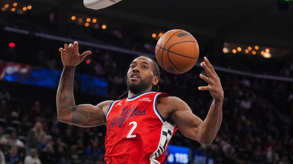Los Angeles Clippers forward Kawhi Leonard descends after making a dunk during the second half of an NBA basketball game against the Philadelphia 76ers Monday, Feb. 2, 2026, in Inglewood, Calif. (AP Photo/Jae C. Hong)