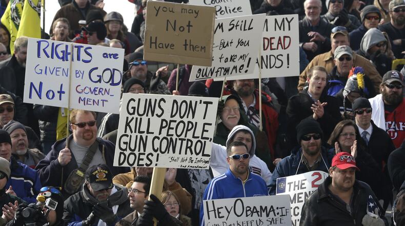FILE - This Jan. 19, 2013, file photo, shows gun-rights advocates gathering outside the Utah State Capitol during the Gun Appreciation Day Rally, in Salt Lake City. Utah lawmakers will hear several bills dealing with guns Wednesday, Feb. 20, 2013, including bills that get rid of Utah's concealed carry permit and declare that Utah alone is able to regulate firearms in the state. One of the most controversial proposals in the Legislature this year says the regulation of guns is reserved to the state. (AP Photo/Rick Bowmer, File)