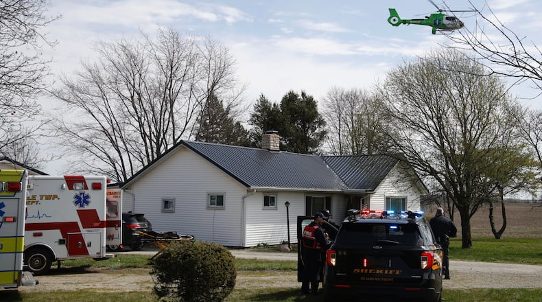 The Clark County Sheriff's Office investigates a shooting at a home in the 7000 block of South Charleston-Clifton Road Monday, March 25, 2024. Deputies arrived at the home to find a woman shot in the driveway and an 81-year-old man with injuries. The woman was flown by MedFlight to Kettering Health Main Campus, where she later died, while the man was transported to the hospital by medic. BILL LACKEY/STAFF