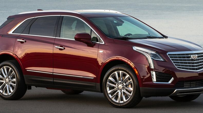 The 2018 Cadillac XT5 crossover includes a rear camera mirror, Apple CarPlay and Android Auto compatibilities, auto-heated steering wheel and front- and rear-seat USB capabilities. Cadillac photo