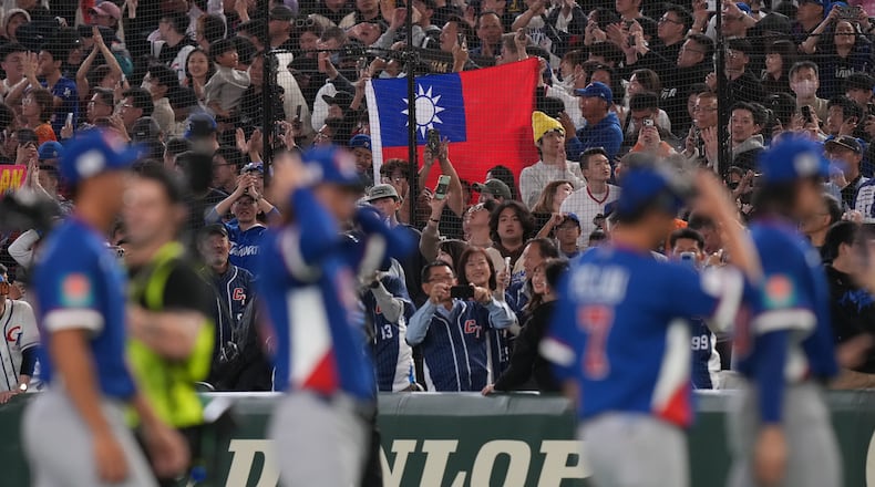 Taiwan players celebrate after defeating South Korea during a World Baseball Classic game between South Korea and Taiwan on Sunday, March 8, 2026 in Tokyo, Japan. (AP Photo/Eugene Hoshiko)