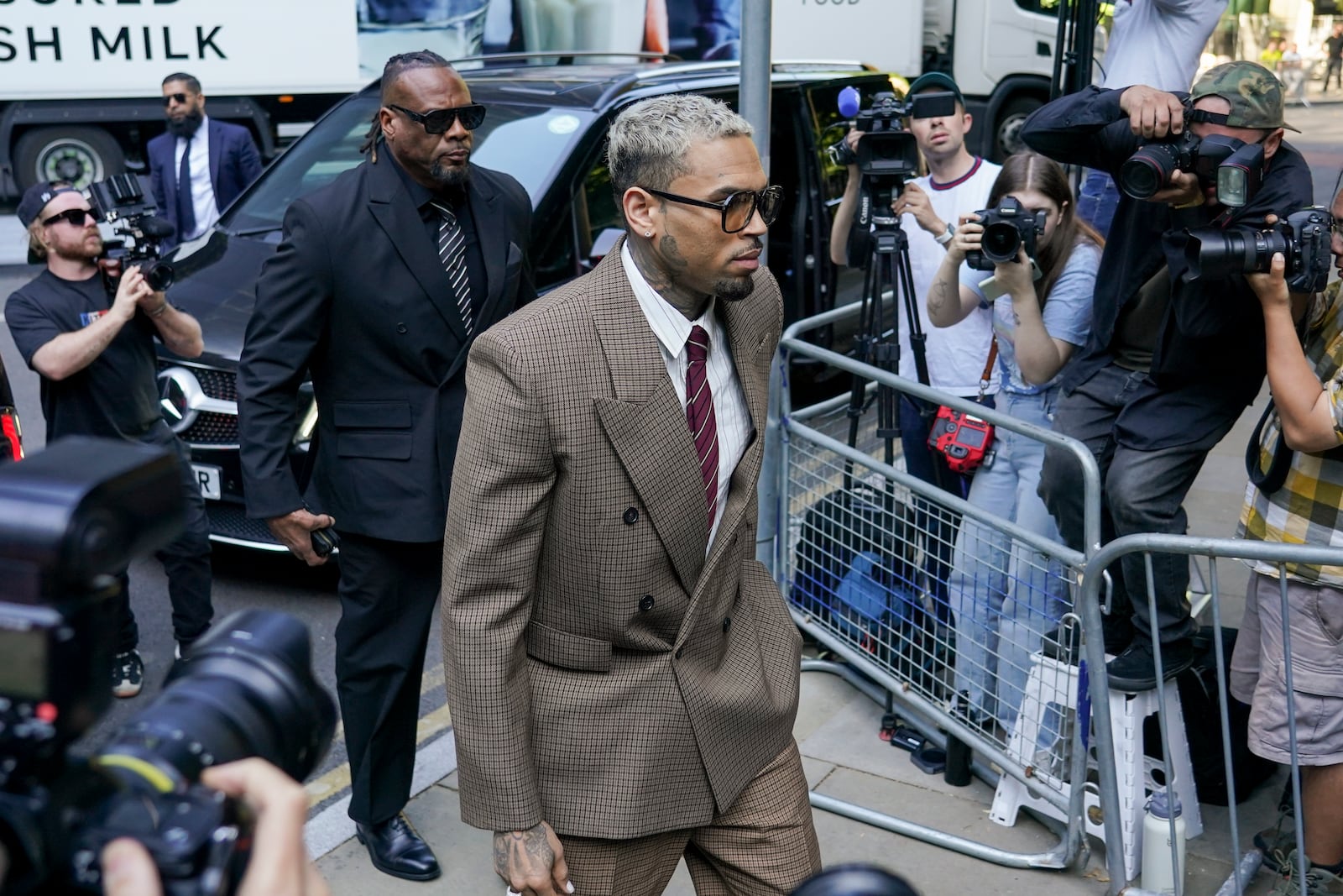 Grammy-winning singer Chris Brown makes his way into Southwark Crown Court, in London, Friday, July 11, 2025.(AP Photo/Alberto Pezzali)