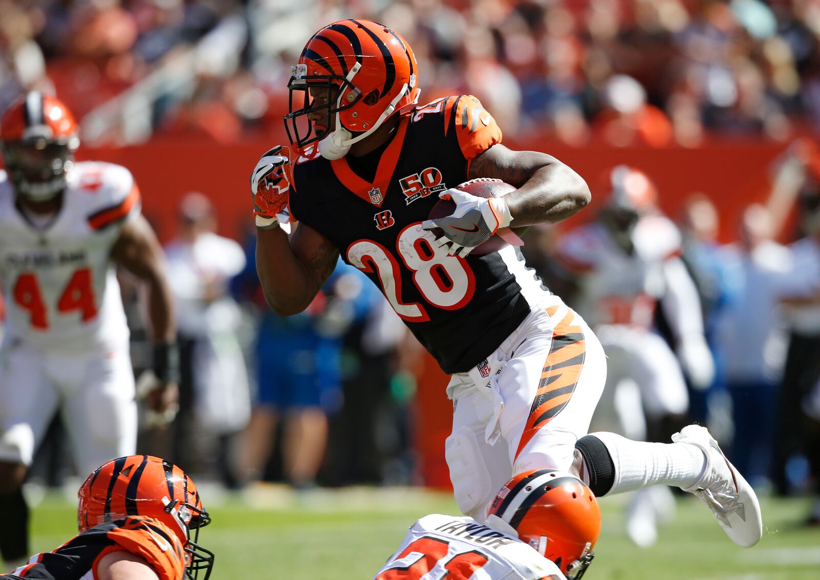 Cincinnati Bengals running back Joe Mixon (28) runs against the Cleveland Browns in the first half of an NFL football game, Sunday, Oct. 1, 2017, in Cleveland. (AP Photo/Ron Schwane)