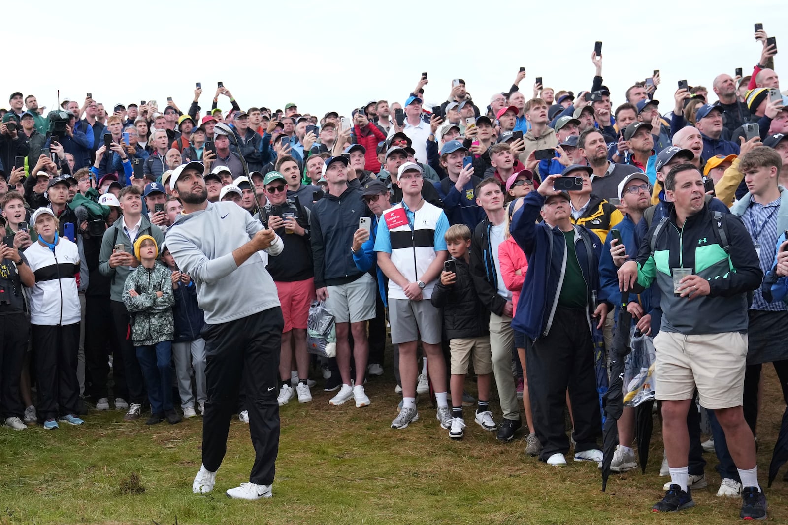 Scottie Scheffler of the United States plays out of the rough on the 17th hole during the second round of the British Open golf championship at the Royal Portrush Golf Club, Northern Ireland, Friday, July 18, 2025. (AP Photo/Jon Super)