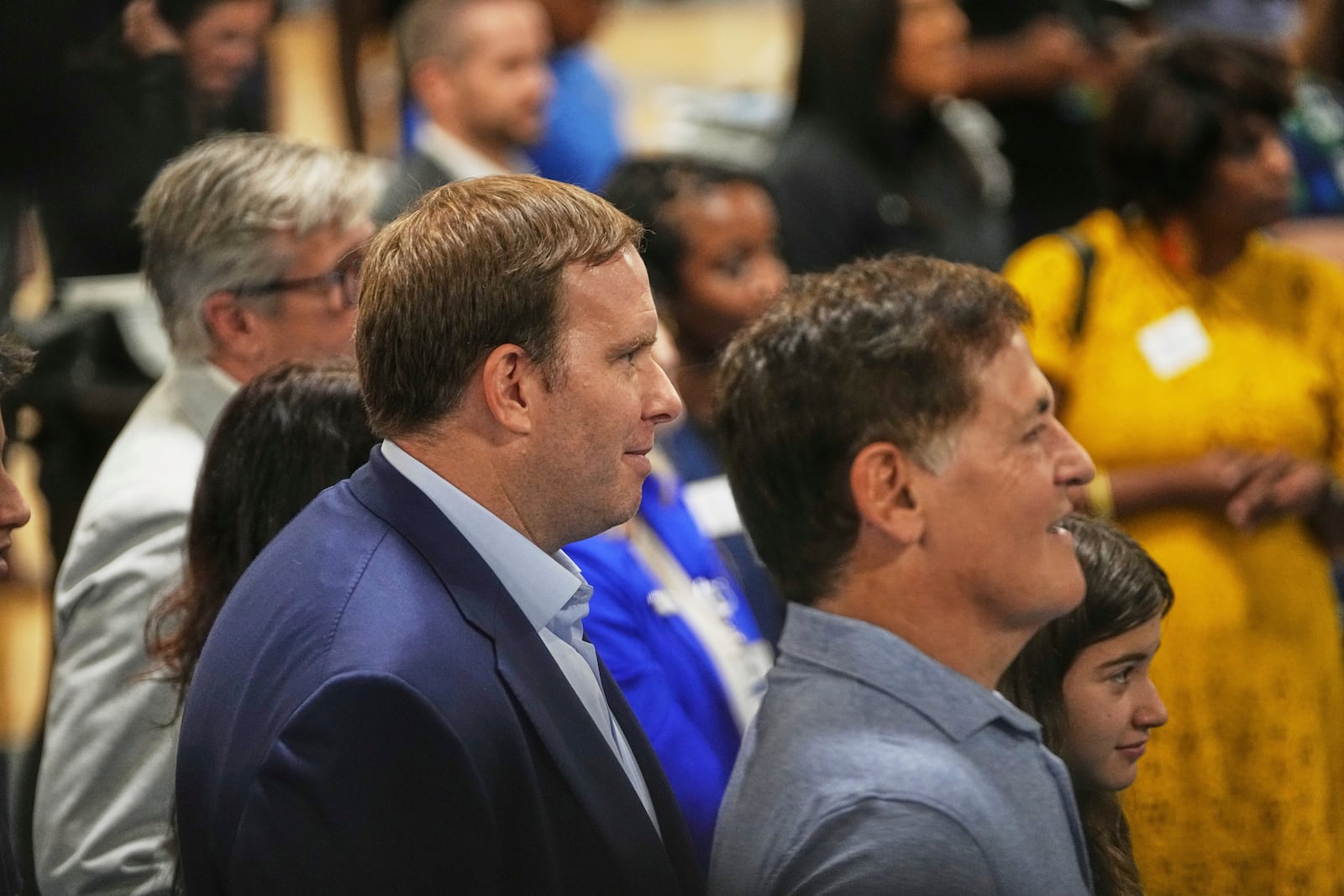 Dallas Mavericks Governor Patrick Dumont, left, and minority owner Mark Cuban, right, look on as Cooper Flagg, the team's No. 1 overall pick in the NBA draft, responds to questions during an NBA basketball press conference at the team's practice facility, Friday, June 27, 2025, in Dallas. (AP Photo/Tony Gutierrez)