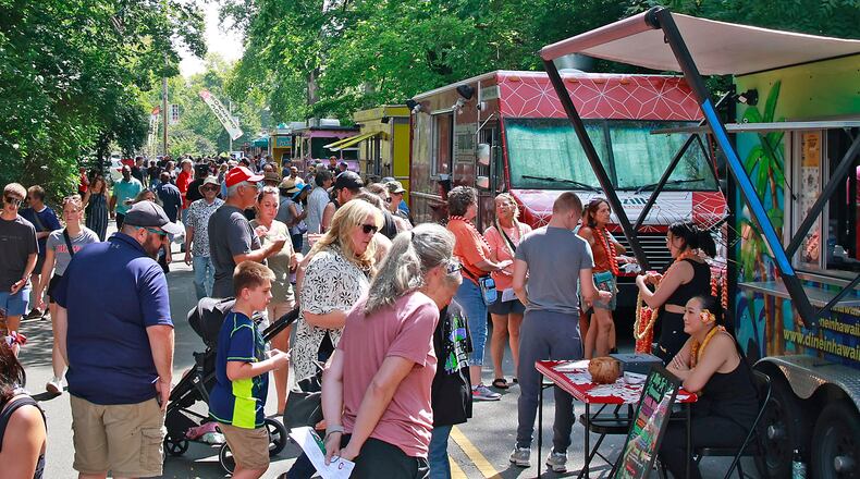 A crowd of hungry people filled Veterans Park Saturday, August 17, 2024 for the 10th annual Springfield Rotary Gourmet Food Truck Competition. BILL LACKEY/STAFF