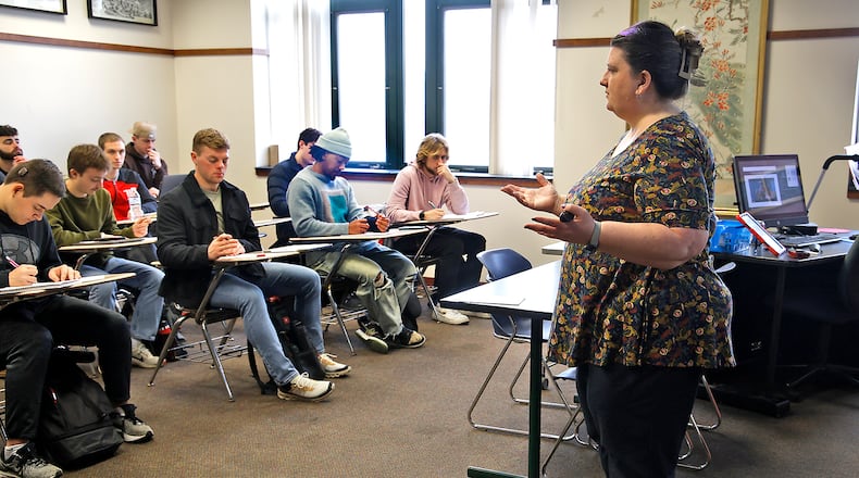 Kelly Dillon, associate professor of communications and digital media, teaches her media literacy class at Wittenberg University Friday, Feb. 16, 2024. BILL LACKEY/STAFF