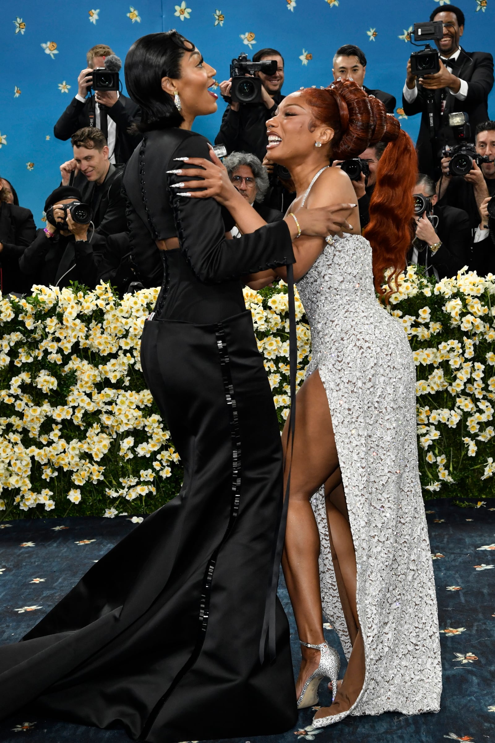 Angel Reese, left, and Megan Thee Stallion attend The Metropolitan Museum of Art's Costume Institute benefit gala celebrating the opening of the "Superfine: Tailoring Black Style" exhibition on Monday, May 5, 2025, in New York. (Photo by Evan Agostini/Invision/AP)