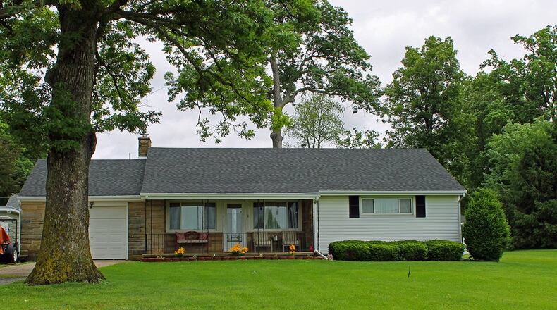 The 3-bedroom ranch home with about 1,510 sq. ft. of living space sits on .72 acres. French doors in the family room lead to an above-ground pool area. CONTRIBUTED PHOTO BY VICKIE KAPNAS