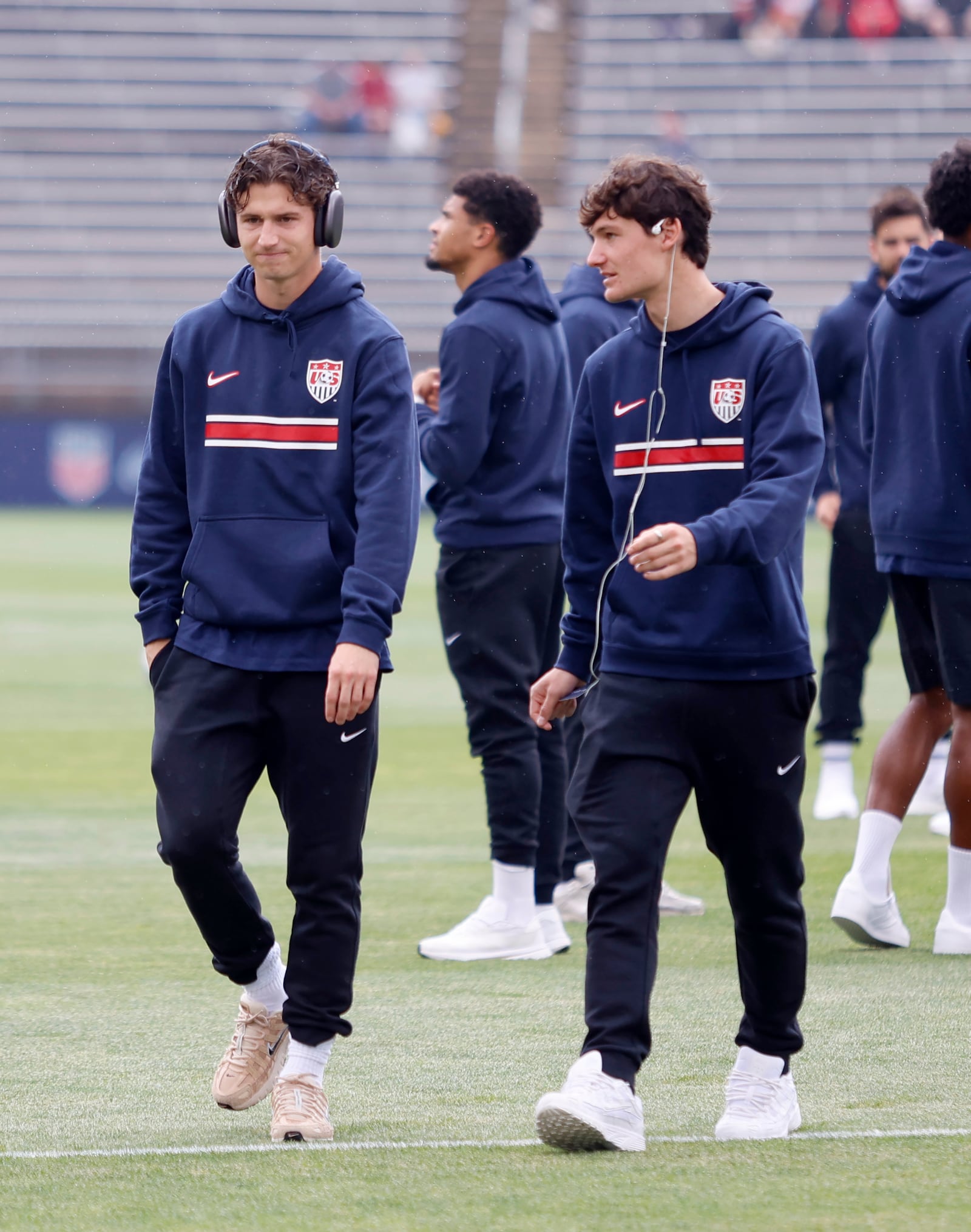 United States midfielder Brenden Aaronson, left, walks of the field with his brother forward Paxten Aaronson before the start of an international friendly soccer game against Turkey, Saturday, June 7, 2025, in East Hartford, Conn. (AP Photo/Mary Schwalm)
