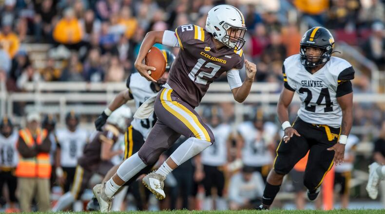 Kenton Ridge High School's Julian Daniels run the ball during their game against Shawnee last season in Springfield. CONTRIBUTED PHOTO BY MICHAEL COOPER