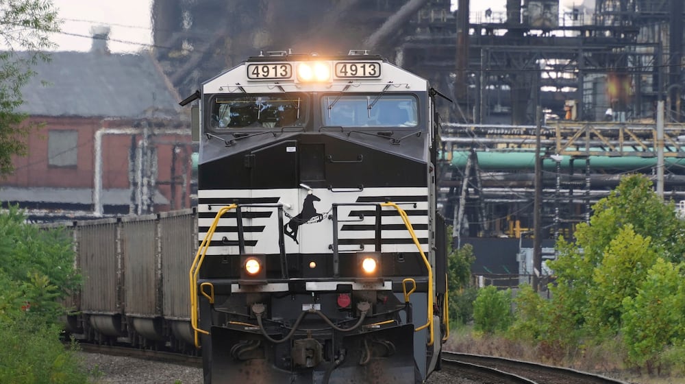 FILE - A Norfolk Southern freight train rolls past the U.S. Steel's Clairton Coke Works, in Clairton, Pa., Aug. 12, 2025. (AP Photo/Gene J. Puskar, File)