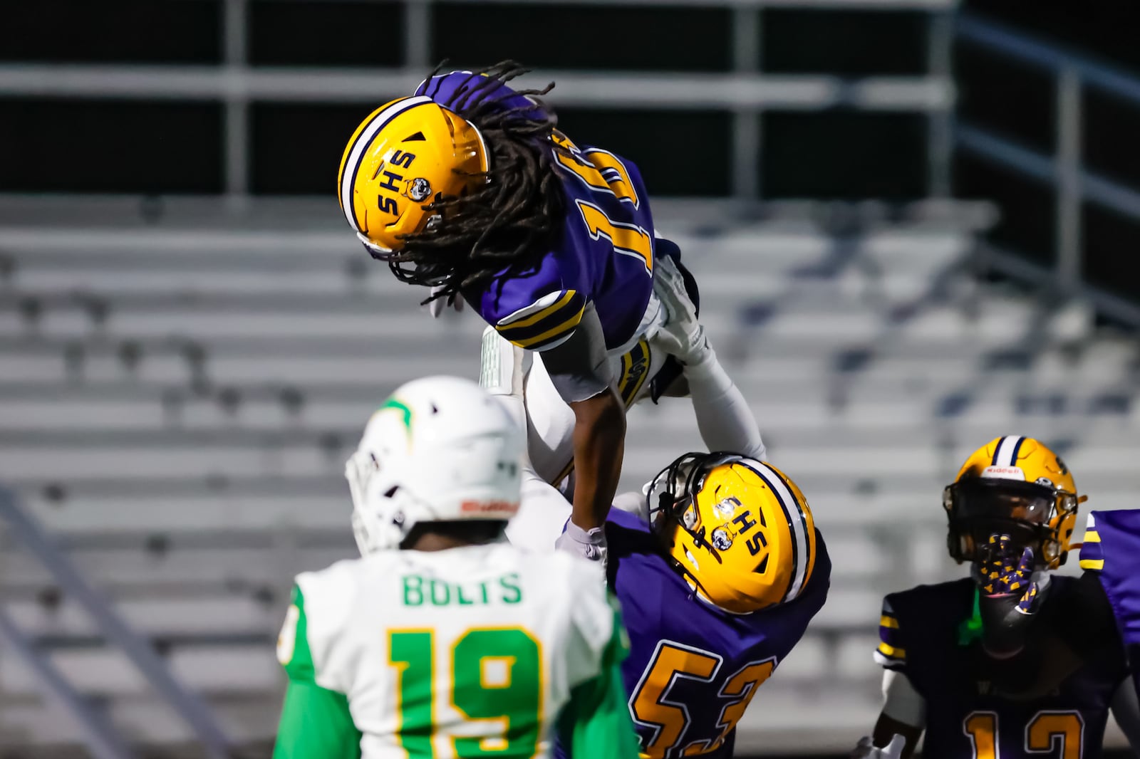 Springfield High School junior Marquis Myers II lifts senior Christopher Summers, Jr. in celebration after he scored a touchdown during their 56-7 win over Northmont on Friday, Oct. 24 at Wildcat Stadium. MICHAEL COOPER / STAFF PHOTO