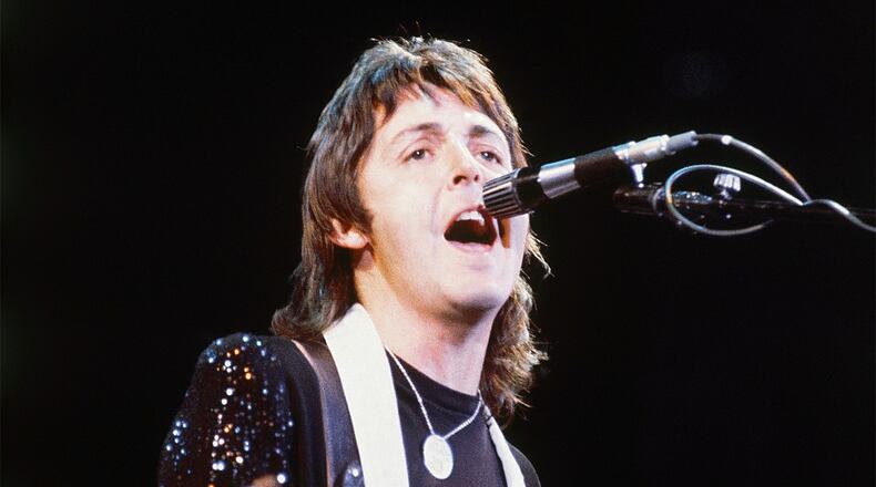 FILE - Paul McCartney, of Paul McCartney and Wings, performs at the Nassau Coliseum in Uniondale, N.Y. on May 21, 1976. (AP Photo/Richard Drew, File)