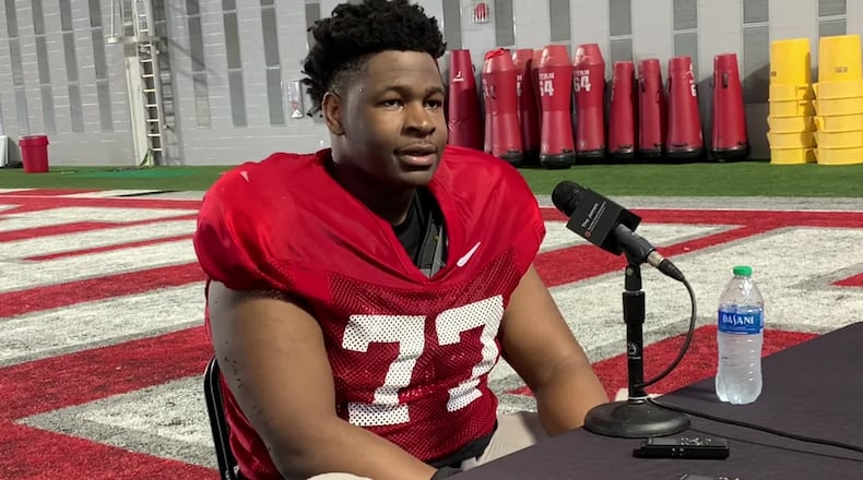 Ohio State offensive lineman Tegra Tshabola talks to reporters Monday in Columbus. Marcus Hartman/STAFF