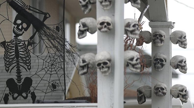 Skulls and skeletons decorate the front of a house along North Murray Street in Springfield for Halloween.