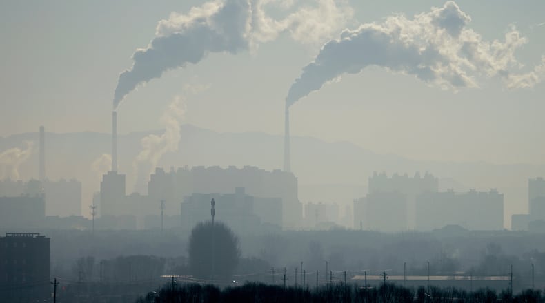 A power plant is seen from a train from Beijing to Shenyang in northwestern China on Jan. 3, 2026. (AP Photo/Ng Han Guan)