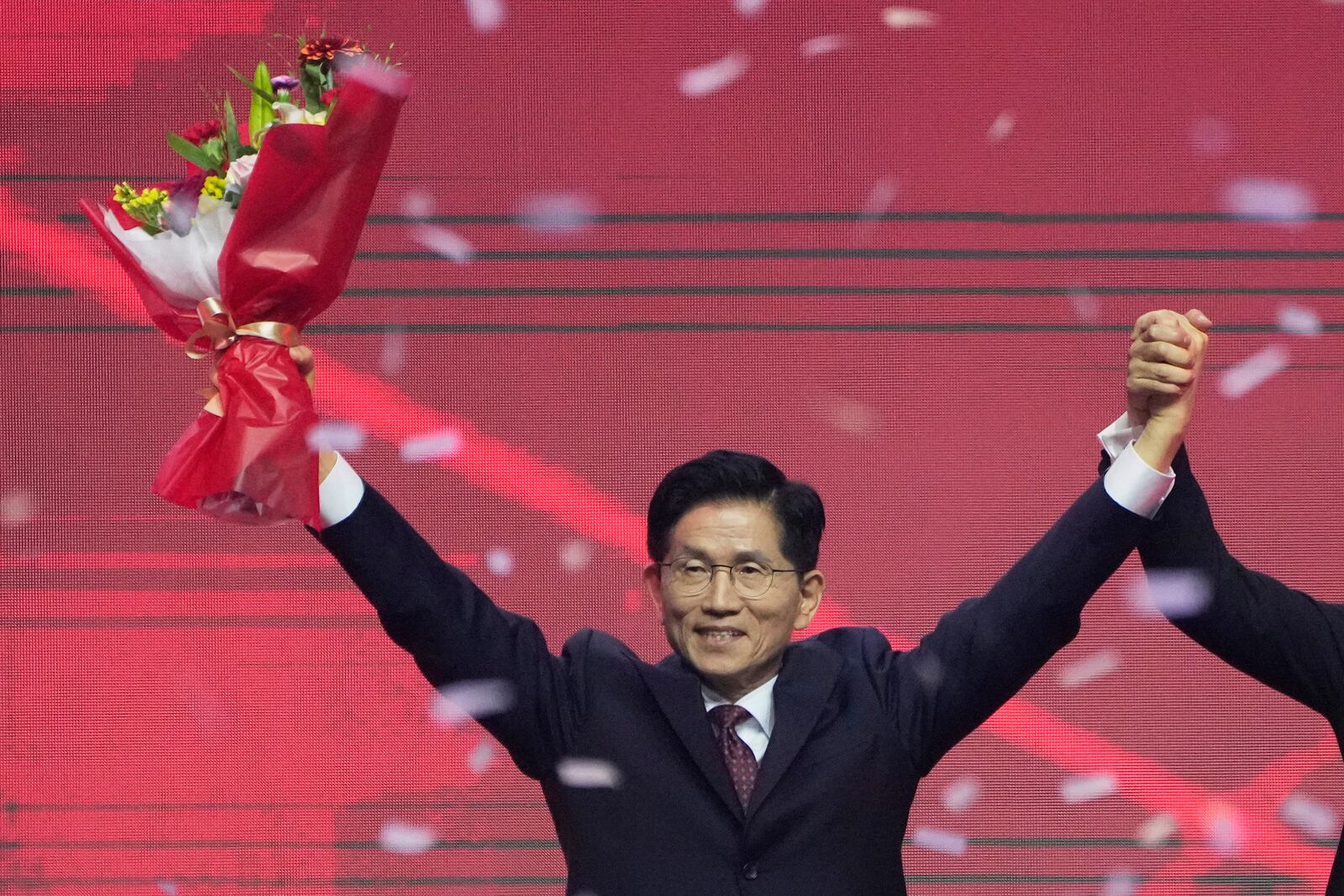 South Korea's former Labor Minister Kim Moon Soo celebrates after winning the nomination as the presidential election candidate during the People Power Party's convention in Goyang, South Korea, Saturday, May 3, 2025. (AP Photo/Ahn Young-joon)