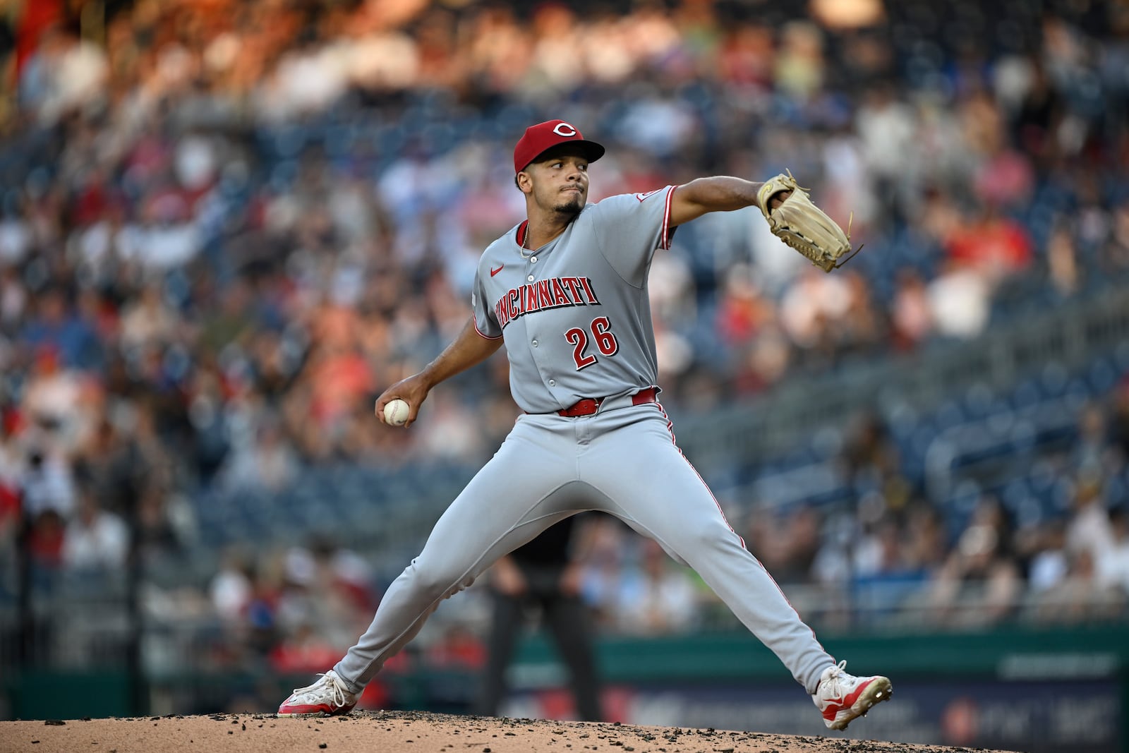 Cincinnati Reds pitcher Chase Burns (26) throws during the third inning of a baseball game against the Washington Nationals in Washington, Tuesday, July 22, 2025. (AP Photo/Terrance Williams)