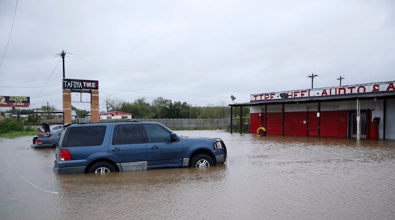 There is significant flooding along Texas 71 at Dry Creek at the Bastrop-Travis county line. (Photo by Jay Janner/American-Statesman)