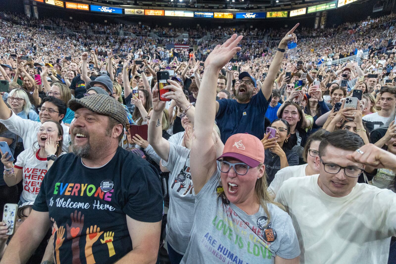 Attendees cheer as Rep. Alexandra Ocasio-Cortez, D-N.Y., speaks during a "Fighting Oligarchy" event at the Ford Idaho Center in Nampa, Idaho, Monday, April 14, 2025. (AP Photo/Kyle Green)