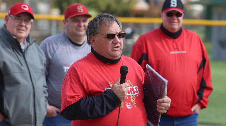 Southeastern High School softball coach Randy "Tojo" Delaney speaks to the crowd during a ceremony honoring his 500th victory before their game against Triad on Monday evening at South Charleston Park. Michael Cooper/CONTRIBUTED