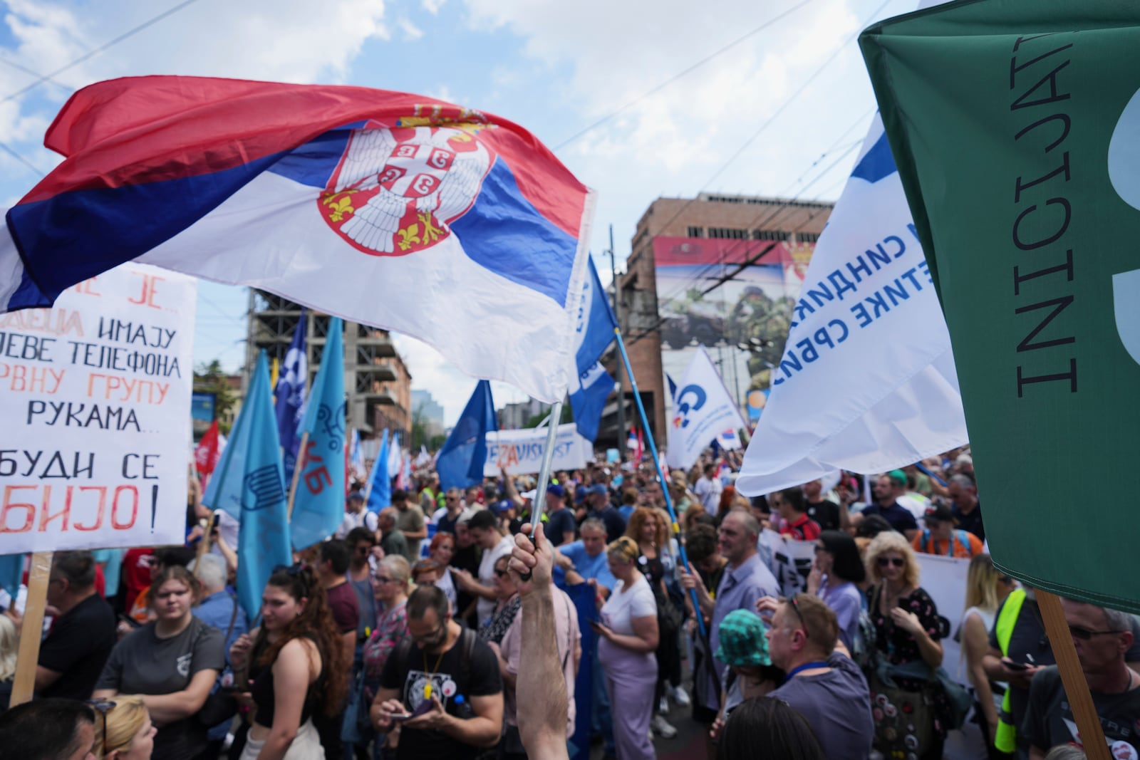 University students and people protest in front of the government building, six months after the deadly train station tragedy that sparked mass demonstrations against corruption, in Belgrade, Serbia, Thursday, May 1, 2025. (AP Photo/Darko Vojinovic)