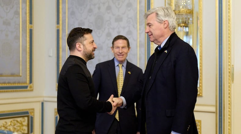 In this photo provided by the Ukrainian Presidential Press Office, Ukrainian President Volodymyr Zelenskyy, left, greets Sen. Sheldon Whitehouse D-R.I. and Sen. Richard Blumenthal, D-Ct., center, in Kyiv, Ukraine, Monday, Feb. 16, 2026. (Ukrainian Presidential Press Office via AP)