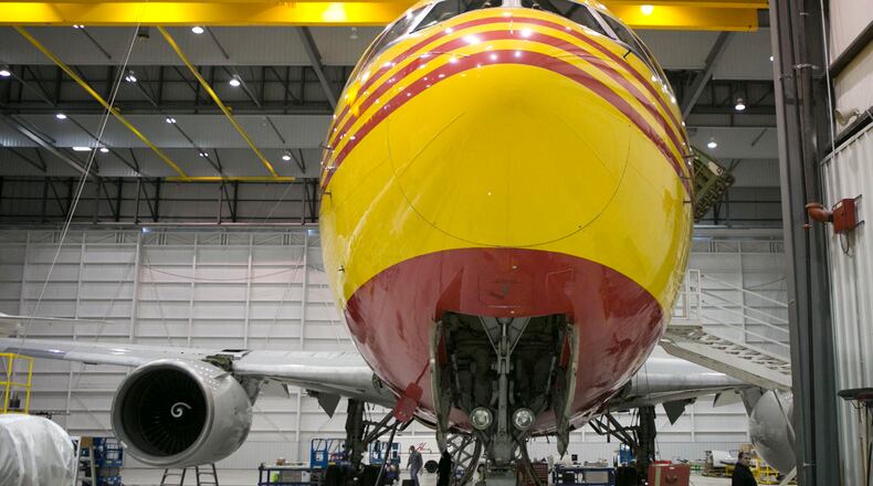 A Boeing 767 painted in DHL livery within a hangar at Airborne Maintenance and Engineering Services at the Wilmington Air Park. TY GREENLEES / STAFF