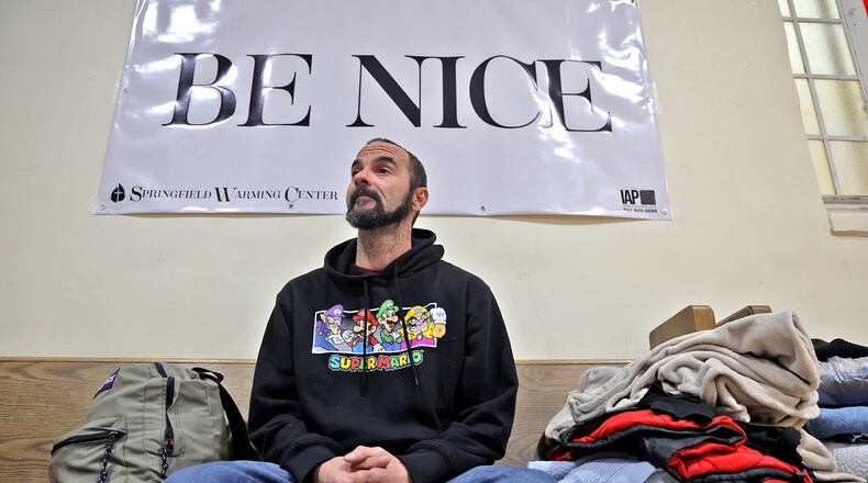Mark Anthony Duvall, who is homeless, says he would have frozen to death if it wasn't for the Springfield Warming Center. Duvall said he was sleeping on the ground outside the Clark County Public Library at night. The warming center's number one rule is "Be Nice" and there are signs hanging around the center to remind people of that rule. BILL LACKEY/STAFF