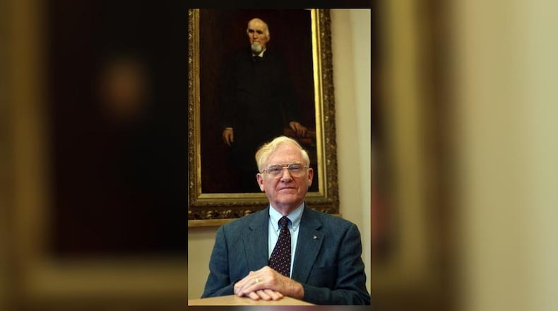 William Kinnison, is in front of artist Jerome Uhl's portrait of Samuel Shellabarger in an exhibit at the Heritage Center. Contributed/Clark County Historical Society.
