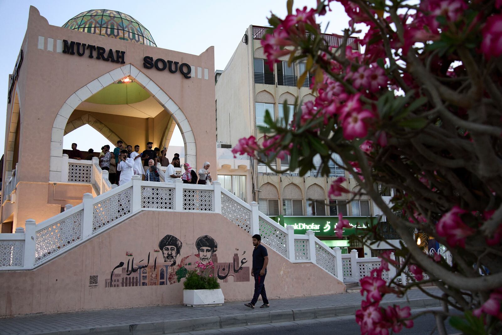 People walk through Mutrah Souq in Muscat, Oman, Friday, April 11, 2025. (AP Photo/ Fatima Shbair)