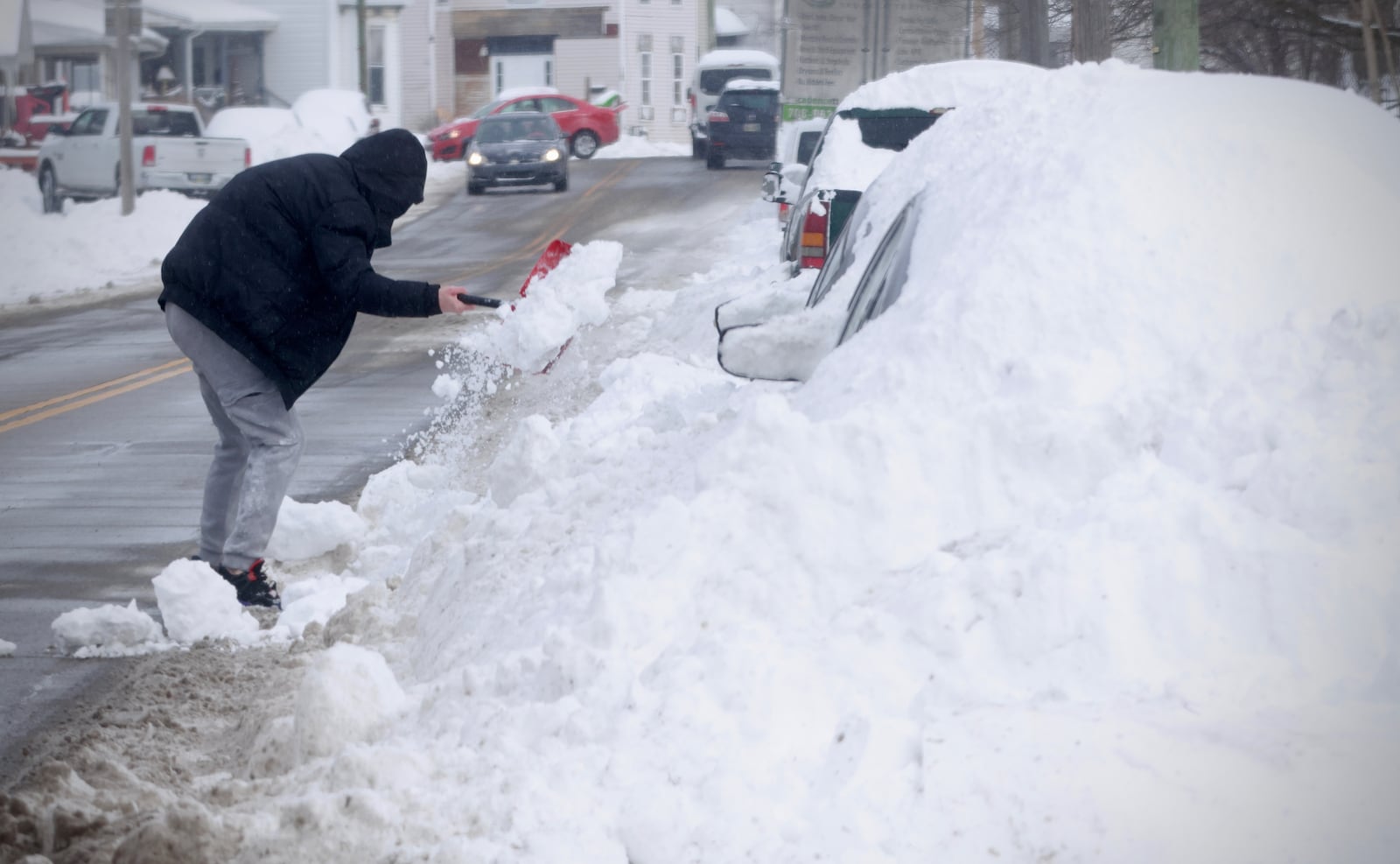 A man digs out his car on Lagonda Avenue in Springfield on Monday, Jan. 26, 2026 after a record single-day snowfall in a weekend storm. CONTRIBUTED / MARSHALL GORBY