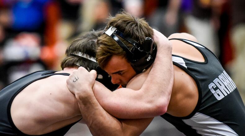 Graham’s Mitch Moore gets the win over Badin’s Kane Schmidt during their match in the 132 pound weight class at Division II District Wrestling tournament Friday, March 3 at Wilmington High School. NICK GRAHAM/STAFF