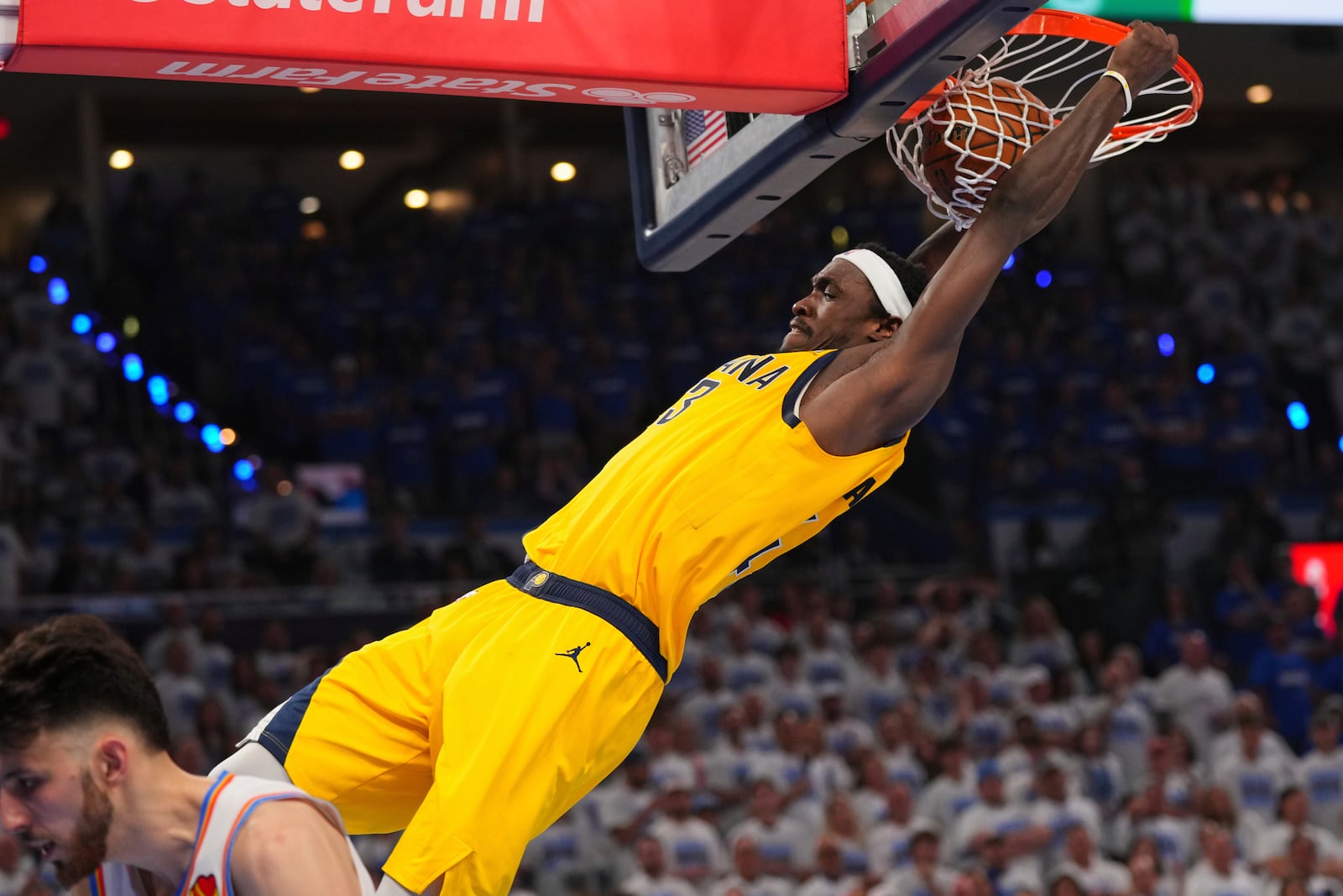 Indiana Pacers forward Pascal Siakam (43) dunks against the Oklahoma City Thunder during the second half of Game 5 of the NBA Finals basketball series, Monday, June 16, 2025, in Oklahoma City. (AP Photo/Kyle Phillips)