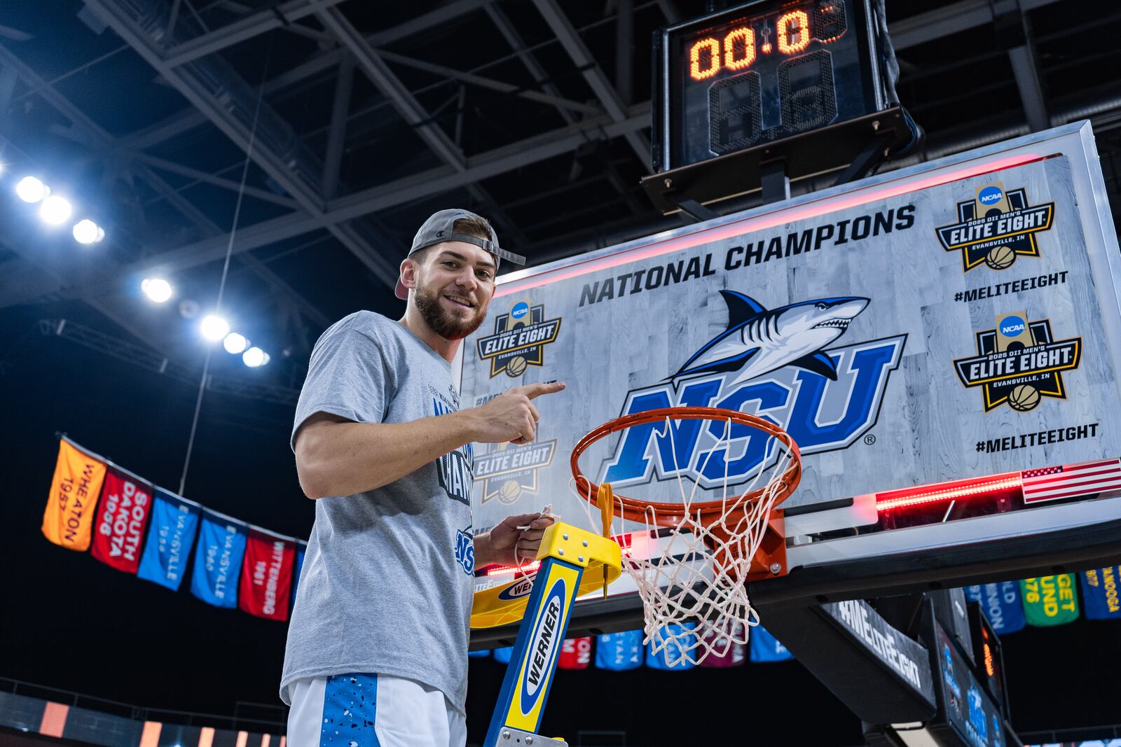 Lakota East grad Alex Mangold prepares to cut down the net after Nova Southeastern beat Cal State Dominguez Hills to claim the Division II national title on March 28 in Evansville, Indiana. CONTRIBUTED PHOTO