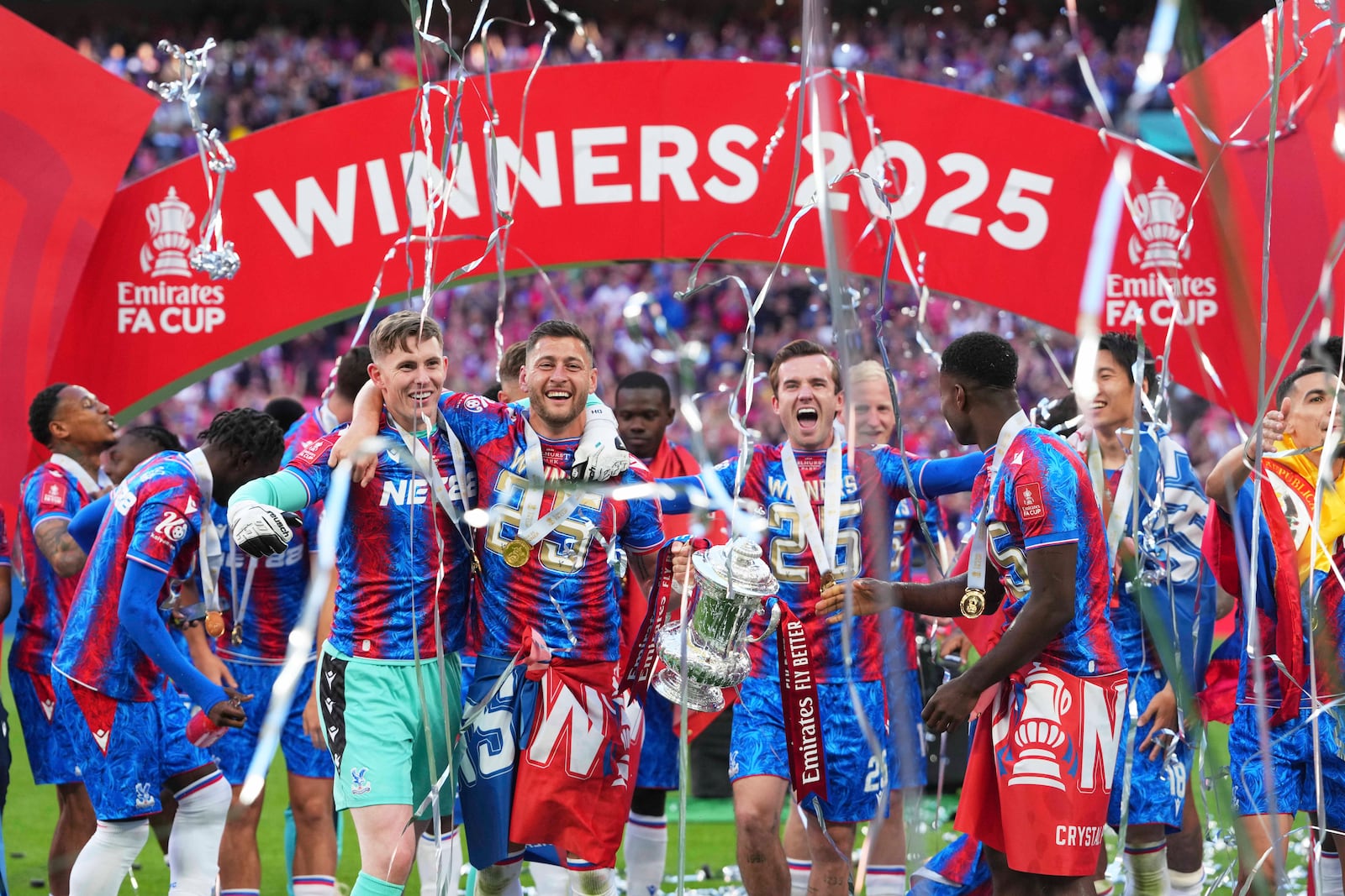 Crystal Palace players celebrate with the trophy after winning the English FA Cup final soccer match between Crystal Palace and Manchester City at Wembley stadium in London, Saturday, May 17, 2025. (AP Photo/Kirsty Wigglesworth)