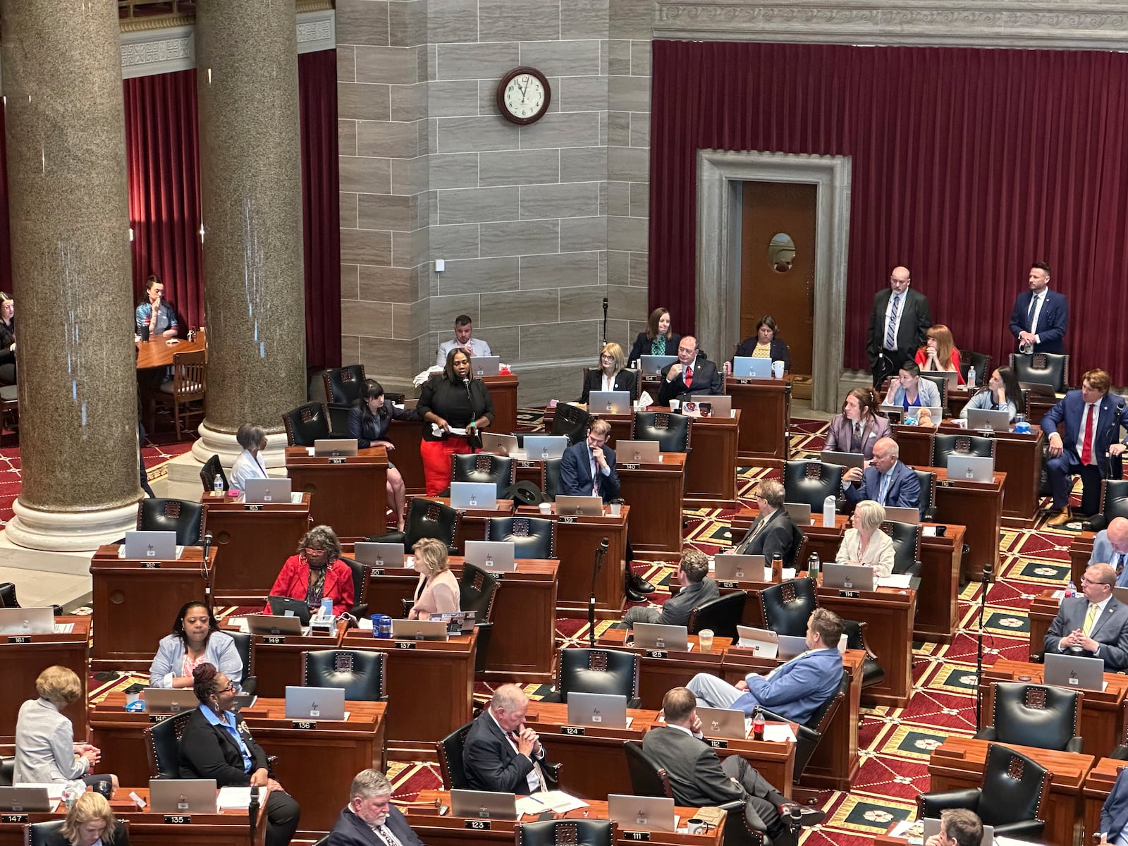 Missouri state Rep. Kimberly-Ann Collins describes for fellow lawmakers gathered in Jefferson City for a special session on Wednesday, June 11, 2025, how she watched a tornado hit her St. Louis home a month earlier. (AP Photo/David A. Lieb)