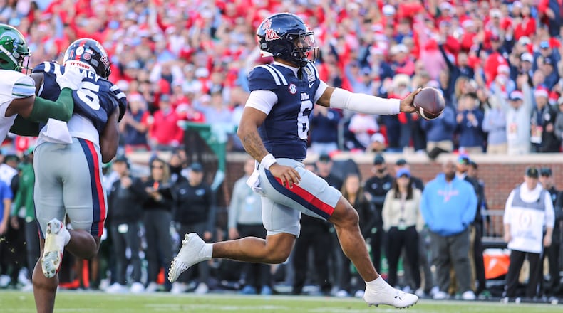 Mississippi quarterback Trinidad Chambliss (6) scores a touchdown against Tulane during the first round of the NCAA College Football Playoff, Saturday, Dec. 20, 2025, in Oxford, Miss. (AP Photo/James Pugh)