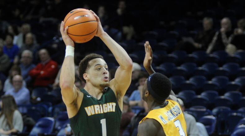 WSU’s Justin Mitchell (with ball) scored 18 points. Wright State defeated host Toledo 77-69 in a men’s college basketball game on Sat., Dec. 16, 2017. MARC PENDLETON / STAFF