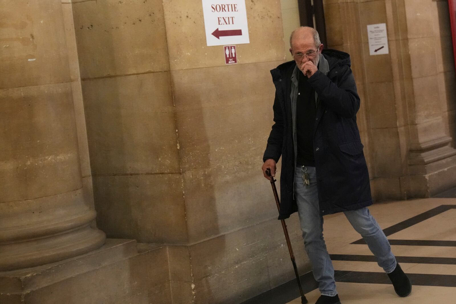 Defendant Aomar Aït Khedache, one of the men accused in the 2016 armed robbery of Kim Kardashian, leaves after the verdict in the trial of Kim Kadashian heist, Friday, May 23, 2025 in Paris. (AP Photo/Christophe Ena)